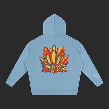 4iir Crystal Lava hoodie in light blue with a vibrant orange and yellow crystal graphic on the back