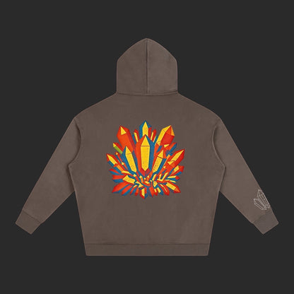 4iir Crystal Lava hoodie in brown with a vibrant red and yellow crystal graphic on the back and sleeve detail.