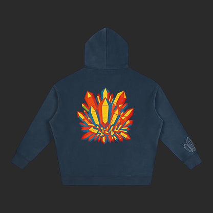 4iir Crystal Lava hoodie in dark blue with a vibrant red and yellow geometric crystal graphic on the back.