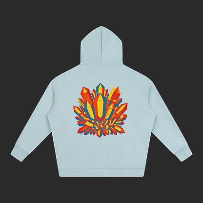 4iir Crystal Lava hoodie in light blue featuring a vibrant red and yellow crystal graphic on the back.