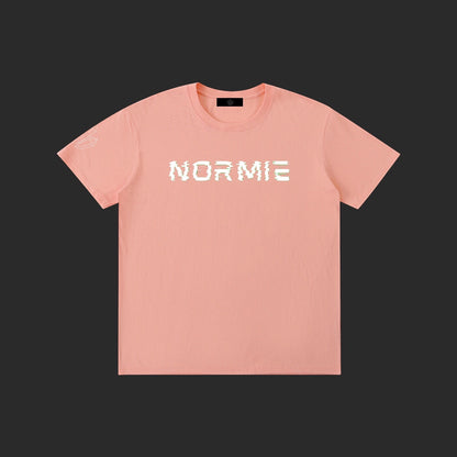 4iir Normie T-shirt in peach cotton with white glitch-style text graphic on chest and small sleeve detail.