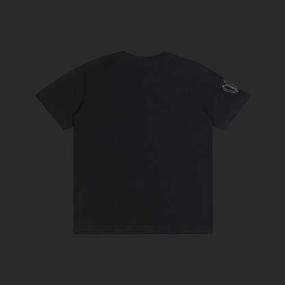 4iir Normie T black cotton t-shirt viewed from the back with a small graphic detail on the left sleeve