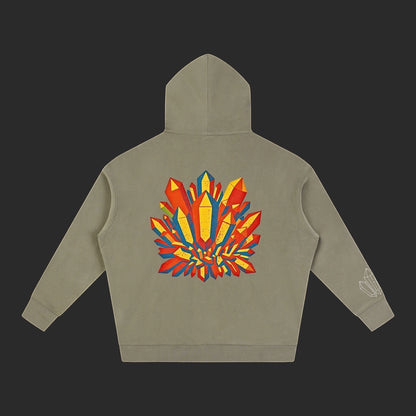 4iir Crystal Lava hoodie in olive green with a vibrant red and yellow crystal graphic on the back.